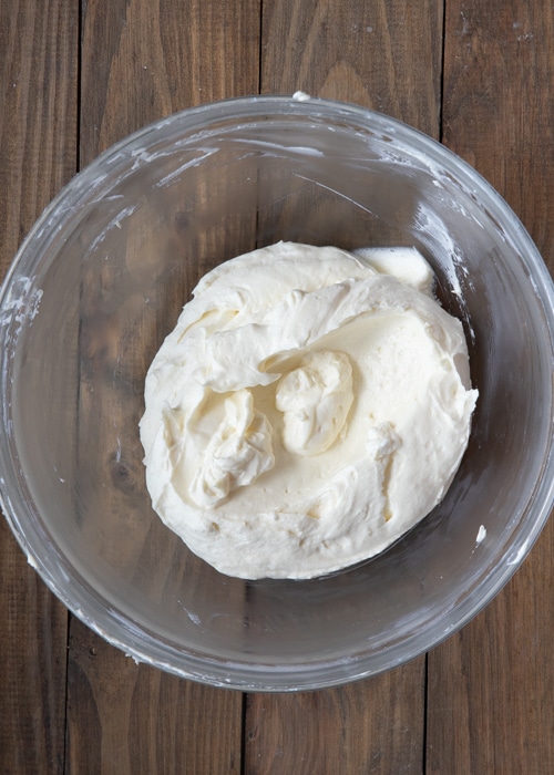 Mixing the cream cheese mixture and the whipped cream.