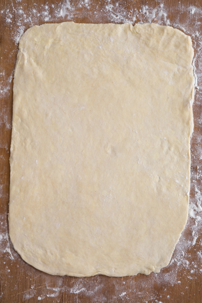 Dough rolled to form a rectangle.