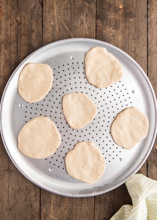 The dough formed into 6 small circles.