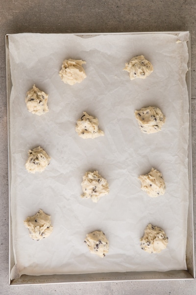 cookie dough dropped by teaspoon full on cookie sheet
